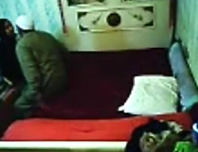 tapes an arab hijab girl having gospeller sex with a guy on the bed